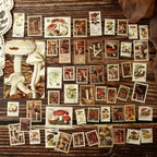 All 50 sepia-toned vintage postage stamp stickers in a grid – aged paper look with antique illustrations and postmarks