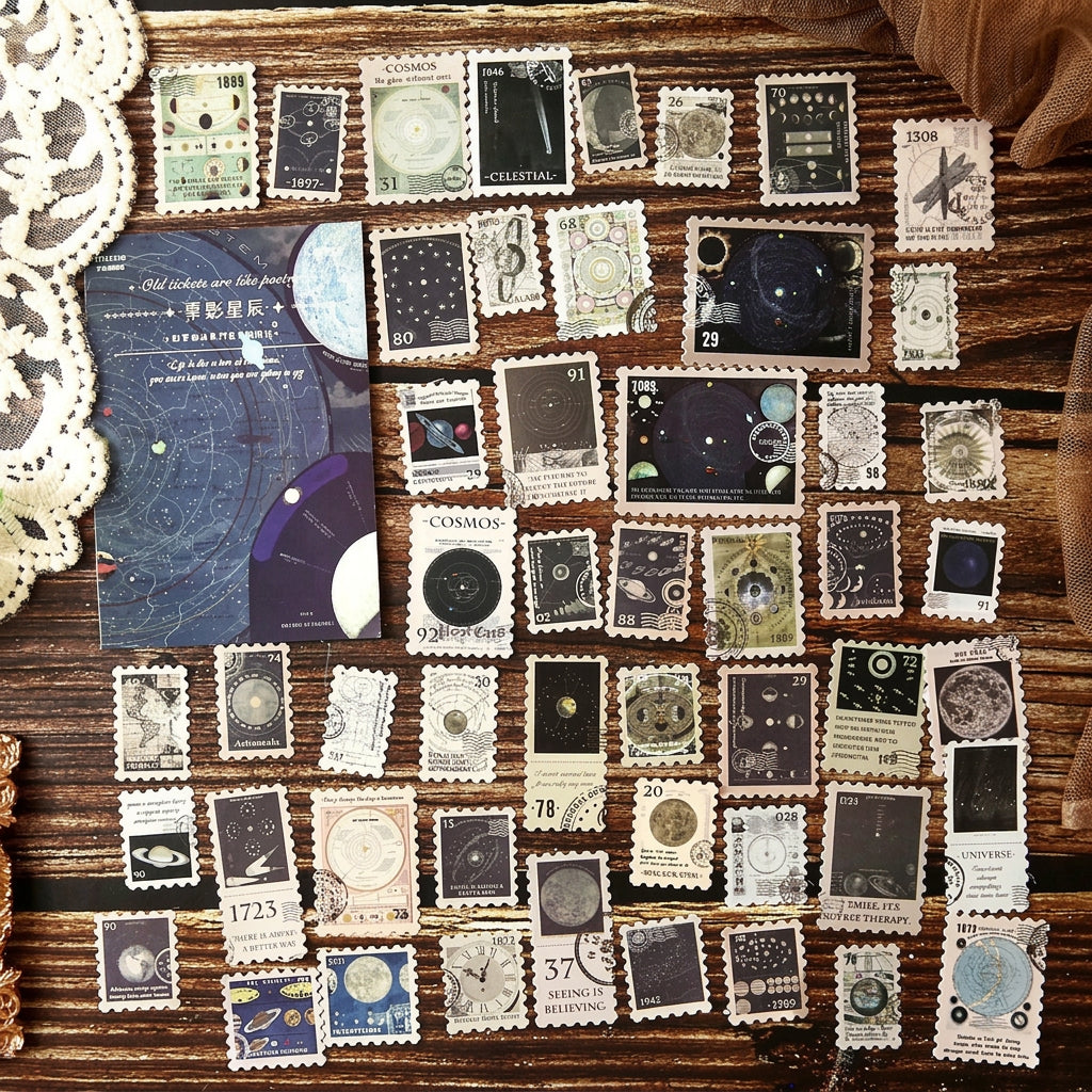 All 50 starry night postage stamp stickers arranged in rows – moon, planet and constellation designs on deep navy paper