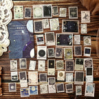 All 50 starry night postage stamp stickers arranged in rows – moon, planet and constellation designs on deep navy paper