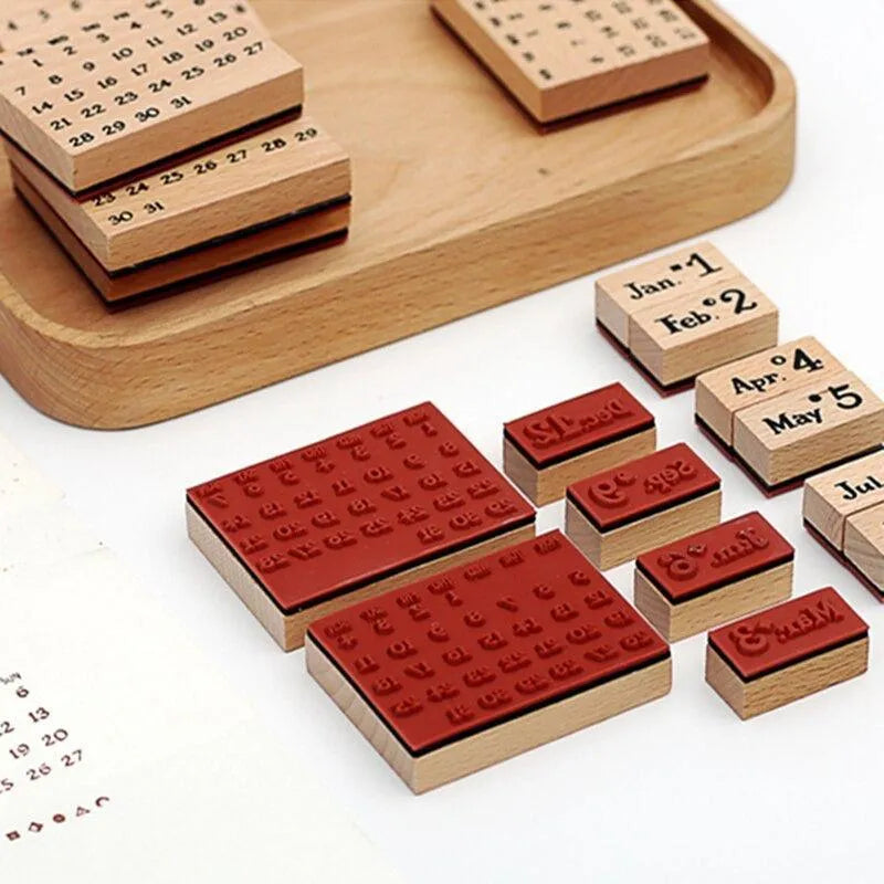 A detailed look at the 20-piece vintage wooden perpetual calendar stamp set, highlighting the premium red rubber bases and solid wood month blocks for aesthetic bullet journaling.