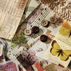 Vintage ephemera pieces with yellow butterflies, sheet music and dried botanicals from the Whispers of Time pack
