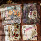 Ink & Old Things color story flat lay – vintage postcards, hang tags, stickers and ephemera sheets in deep green tones