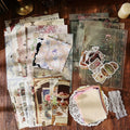 Ephemera pack contents with vintage postcards, hang tags, bookmarks and memo sheets – 140 pieces total