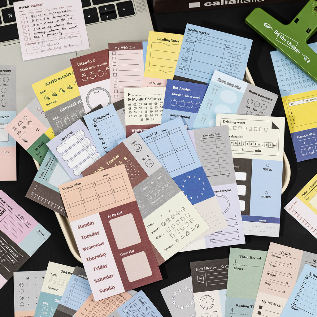 assorted writable planner sticker sheets scattered budget habit tracker daily planning layouts