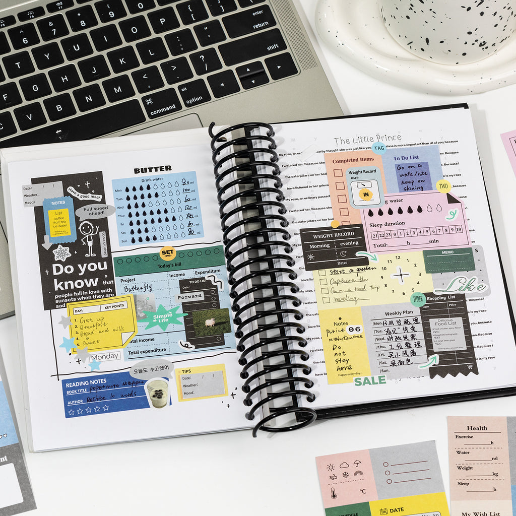 using writable planner stickers at desk with laptop budget and schedule tracking sheets