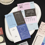	writable planner sticker sheets arranged on tray color block budget and habit layouts