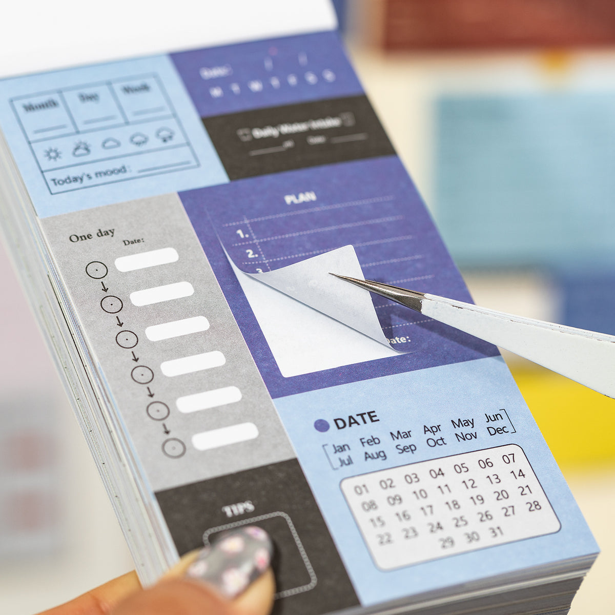 	using writable planner stickers at desk with laptop budget and schedule tracking sheets